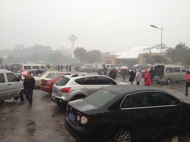 a car partially on ice