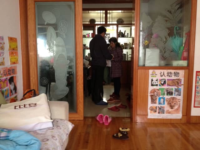 A dimly lit interior space with wooden accents and glass panels