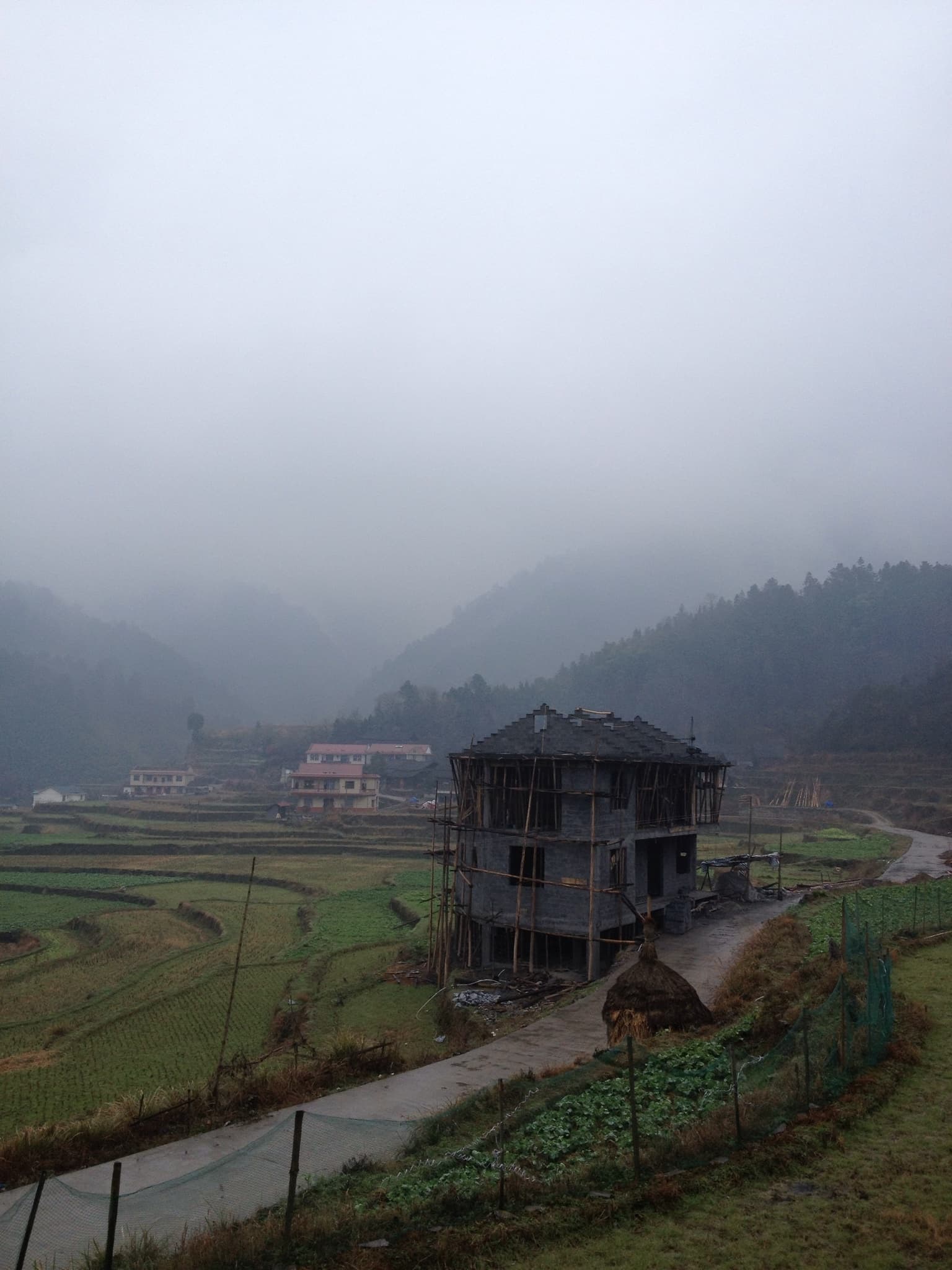 A building on a foggy mountain