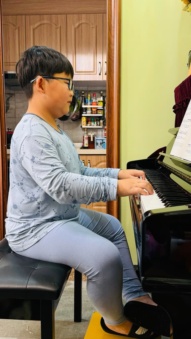 boy playing piano