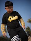 man wearing black and yellow shirt with white striped pants