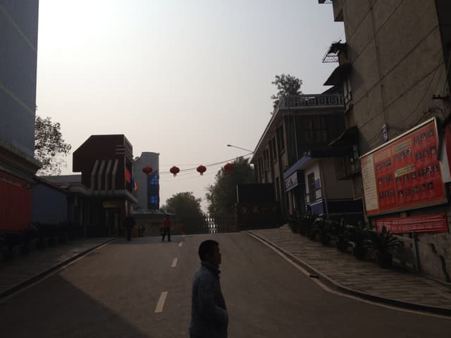 A city street with buildings on either side