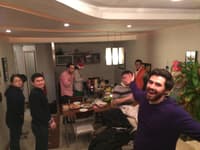 Group of people smiling at a table