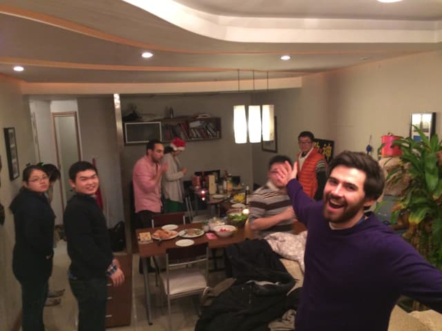 Group of people smiling at a table