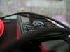 Closeup of a steering wheel with buttons and controls