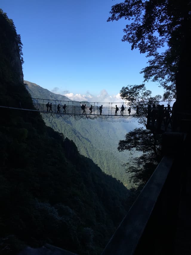 People climbing a mountain on a trail
